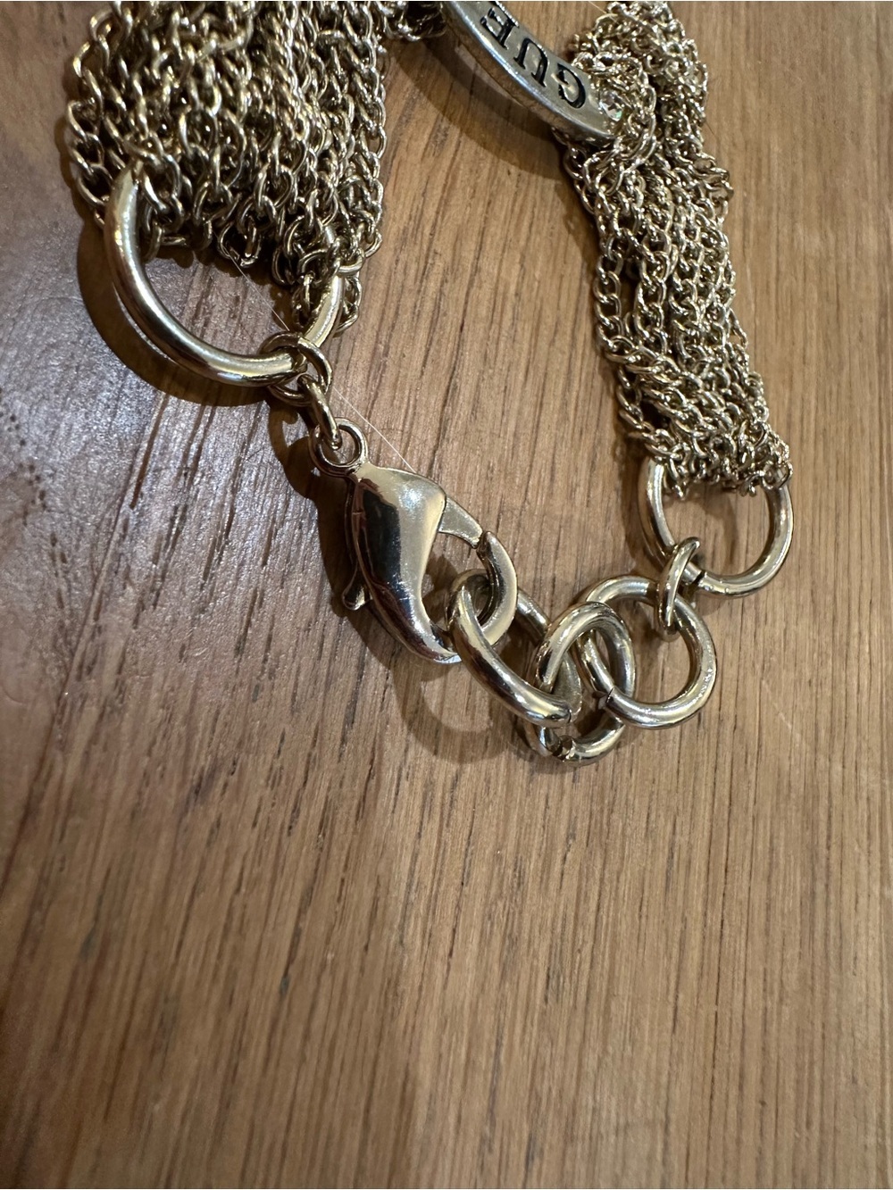 GUESS Gold-Tone Multi-Chain Logo Ring Bracelet with Crystal Accents - Picture 4 of 8